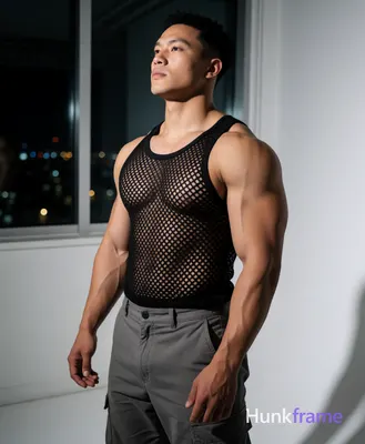 Heavily muscular adult man with substantial muscle mass, wide shoulders, thick neck, large chest and