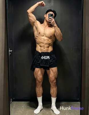 photoreal photograph of a handsome muscular man with defined abs and thick thigh