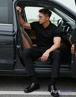 Asian man with short textured dark brown crop hair and side parting, wearing thin metal rimmed glass