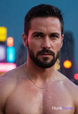 A muscular man with short dark hair, a beard, and serious expression stands conf