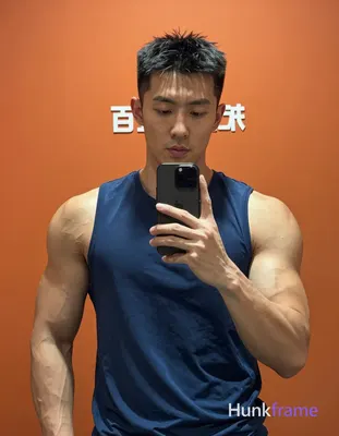 Asian man with light to medium tan skin and short dark black hair featuring a te