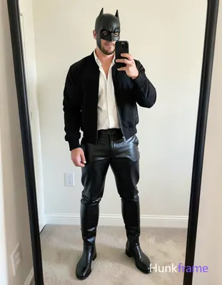 A handsome adult man stands in a candid mirror selfie, legs slightly apart showing thick thighs and 
