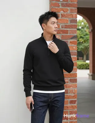 Asian man, light-medium skin, short textured black hair styled upward at the crown with tapered side