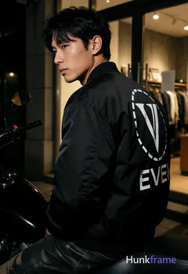 Asian man with light to medium tan skin and short dark black tousled hair, side-parted fringe over f