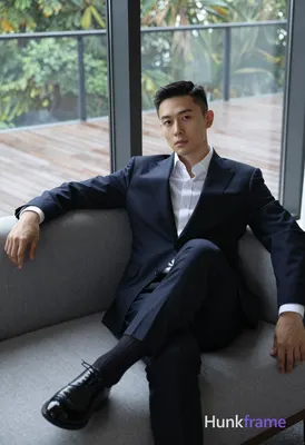 Photograph of exactly 1 adult man. Man 1: East Asian, light to medium, oval with defined jawline, sh
