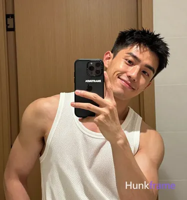 an anonymous figure men in a mirror selfie composition, left side of frame domin