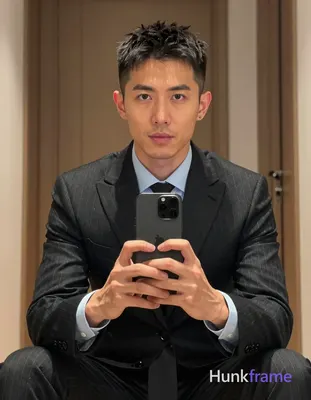 Photograph of exactly 1 adult man. Man 1: Asian, light to medium tan, oval with defined jawline and 