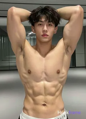 Asian man with short dark brown textured hair and fringe, clean-shaven face, neutral intense gaze; S