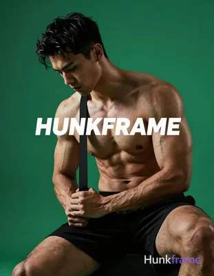 A striking full-bleed vertical phone wallpaper of a muscular adult man with dark short slightly wavy