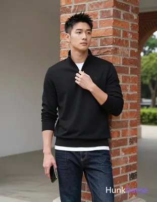 Asian man, light-medium skin, short textured black hair styled upward at the crown with tapered side