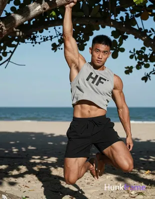 Asian man with tanned skin and short black textured crop top hair, clean-shaven 