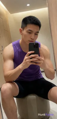 Asian man with light-medium skin and short black buzz cut featuring a textured top layer, clean hair