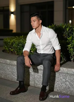Asian man with short black straight side-parted hair and clean-shaven face, neut