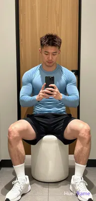 Asian man with light to medium tan skin and short dark brown hair featuring textured top, faded side
