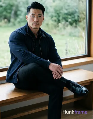 Asian man with fair skin and black short hair styled back with volume at crown, 