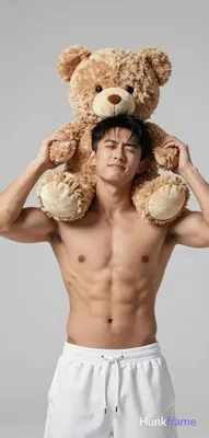 Asian man medium-tan skin black short hair side-swept bangs clean-shaven head ti
