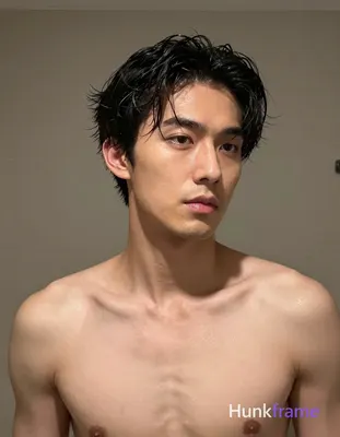 Asian man with short dark black slightly wavy wet-looking hair parted left, clean-shaven face neutra