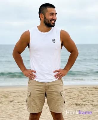 Asian man with light-medium tan skin and short black buzz cut, clean-shaven face smiling with confid