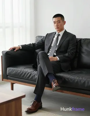 an anonymous figure adult man with short black buzz cut and clean-shaven face, s
