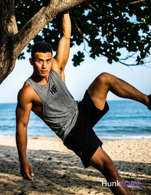 Asian man with tanned skin and short black textured crop top hair, clean-shaven 