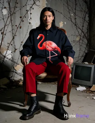 Asian man with medium-tan cool skin and long dark black hair center-parted, seat
