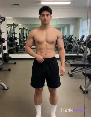 Photograph of exactly 1 adult man. Man 1: Asian, light-medium, square-jawed with defined cheekbones,