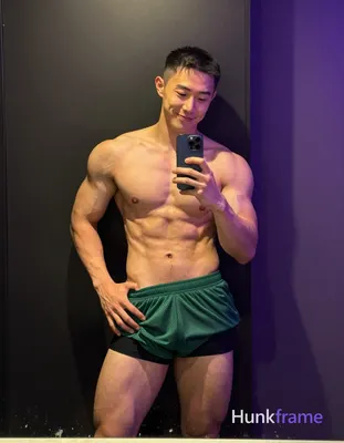 Asian man with short buzz cut and clean-shaven face smiling relaxed in a bold fl