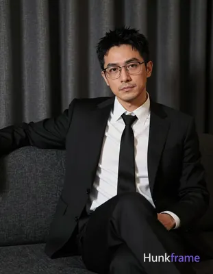 an anonymous figure man with light to medium skin and short textured black hair, wearing rectangular