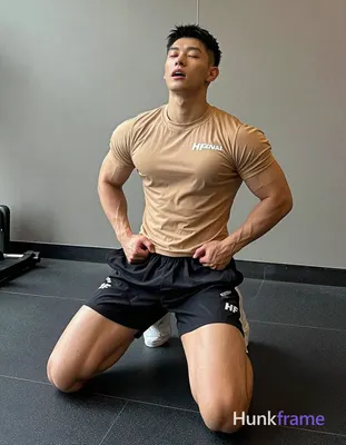 Asian man with short black buzz cut and clean-shaven face, eyes closed mid-exertion mouth open; High