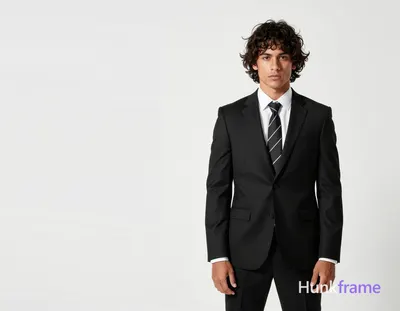 an anonymous figure man with fair light tan skin, dark brown medium-length tousled hair with side-sw