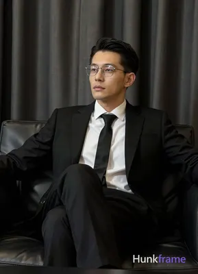 an anonymous figure man in his 30s with light to medium skin, short black straight hair and neat sid