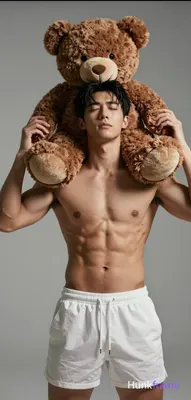 Asian man with medium-tan skin, black short hair side-swept bangs, clean-shaven. Standing upright sh