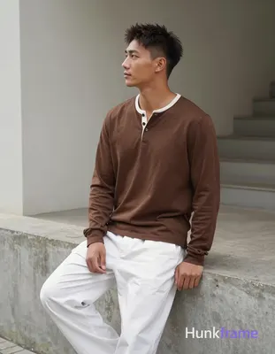an anonymous figure man with light to medium tan skin, short textured dark brown hair styled upward