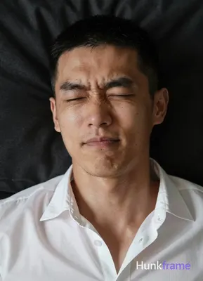 Photograph of exactly 1 adult man. Man 1: East Asian, light to medium tan with natural texture and p