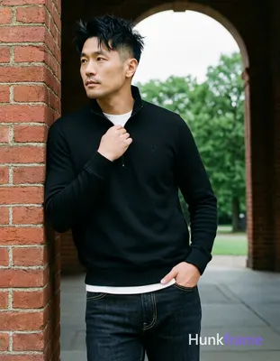 Asian man, light-medium skin, short textured black hair styled upward at the crown with tapered side