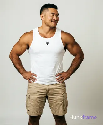 Asian man with light-medium tan skin and short black buzz cut, clean-shaven face smiling with confid