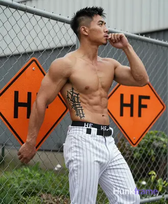 Asian man with light tan skin, short black hair tapered at sides and clean-shaven face, neutral focu