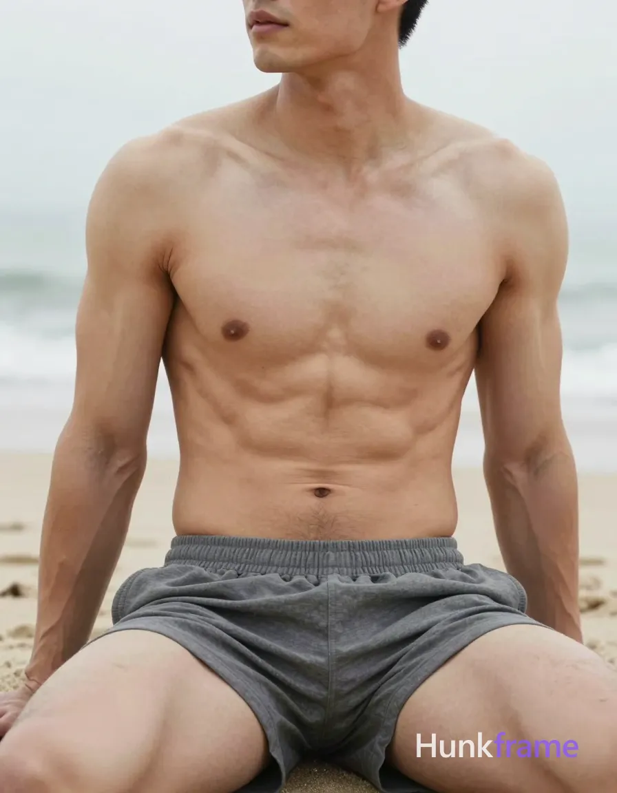 A photorealistic photograph of a handsome, masculine male with defined abs and broad shoulders, seated on a serene beach. The image is cropped to show only his torso, with his head tilted slightly to the side but out of frame. Soft lighting and neutral tones create a romantic aesthetic. High image quality with no grain or blur, capturing every detail of his muscular physique in natural light