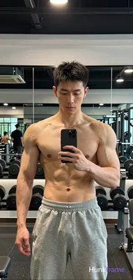 Photograph of exactly 1 adult man. Man 1: Asian, light-medium, oval with defined jawline, short dark