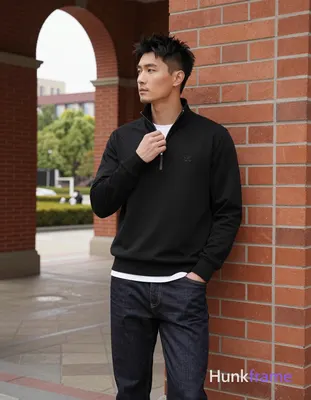 Asian man, light-medium skin, short textured black hair styled upward at the crown with tapered side