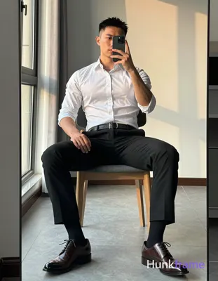 Full-body mirror selfie of an adult man with light-medium skin and short dark ha