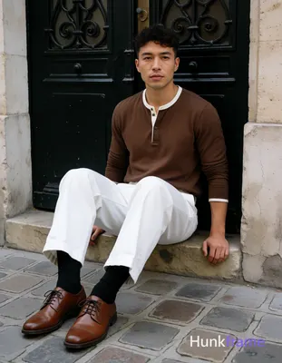 Asian man with short dark brown undercut hair and clean-shaven face, neutral con