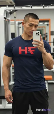 Asian man with medium-tan skin and short buzz cut, light stubble on jawline hold