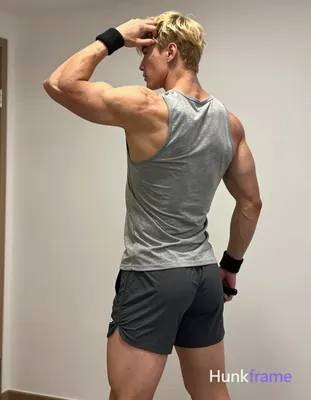 Polished anime style rendering of an adult muscular man standing in profile, left arm raised behind