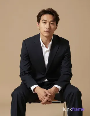 Asian man with fair to light tan warm skin, short dark brown hair side-parted sw