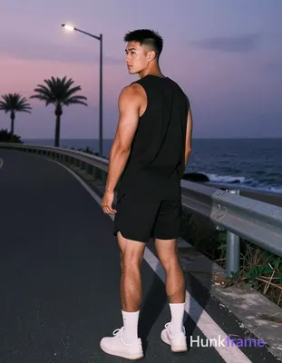 Asian man with medium-tan skin and a short black buzz cut featuring textured fade on sides, clean-sh