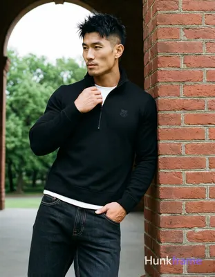 Asian man, light-medium skin, short textured black hair styled upward at the cro