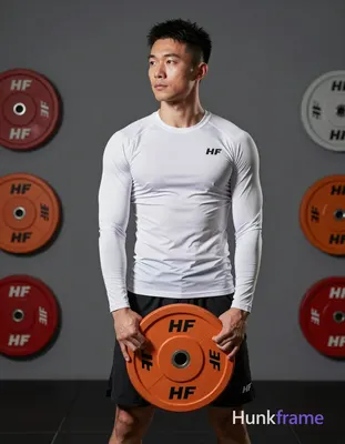 Asian man with light-medium skin, short black textured hair and faded sides, clean-shaven face, neut