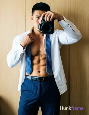 pulling white dress shirt wide open to reveal bare chest and abdomen; Blue striped necktie hangs loo