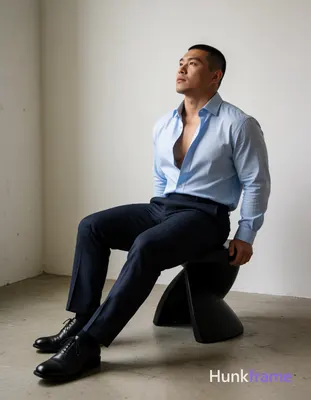 Heavily muscular adult man with substantial muscle mass, wide shoulders, thick n